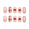 Red Heart Plaid Bow Press-On Nails on a pure white background, front view