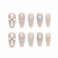 Blue Bow Snowflake Press-On Nails on a pure white background, front view